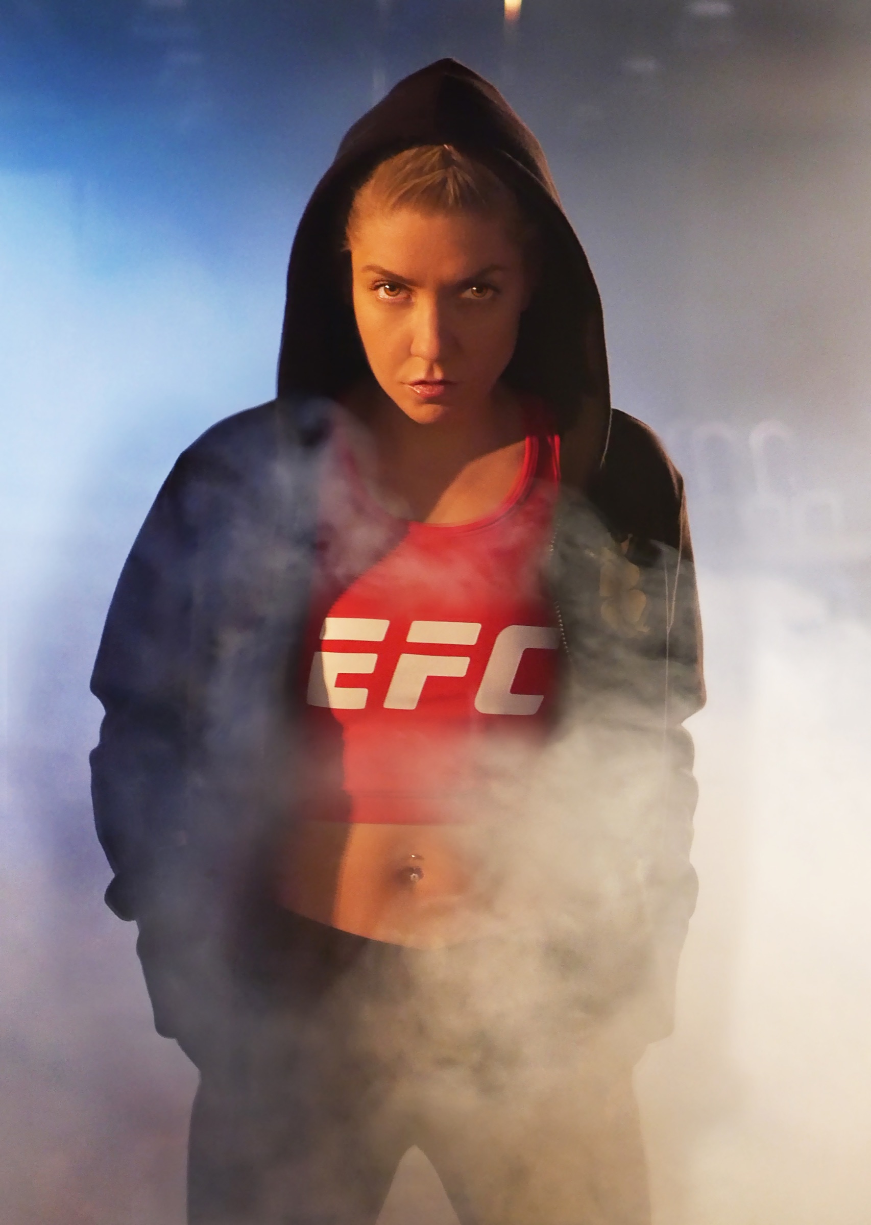 Cassady Jones emerges through smoke wearing her EFC fight gear